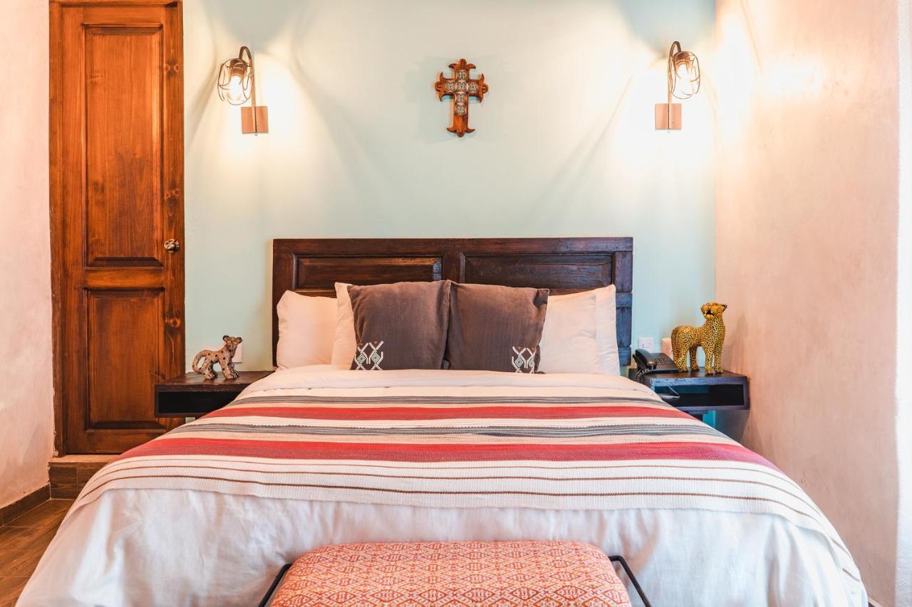 Yox Hotel Boutique San Cristóbal de Las Casas المظهر الخارجي الصورة A bedroom at the hotel