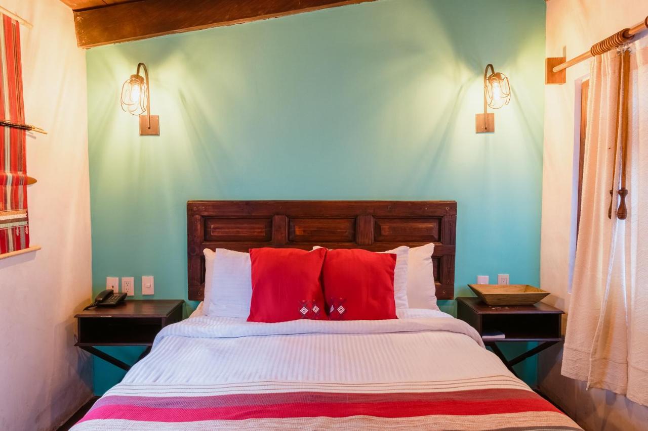 Yox Hotel Boutique San Cristóbal de Las Casas المظهر الخارجي الصورة A bedroom at the hotel