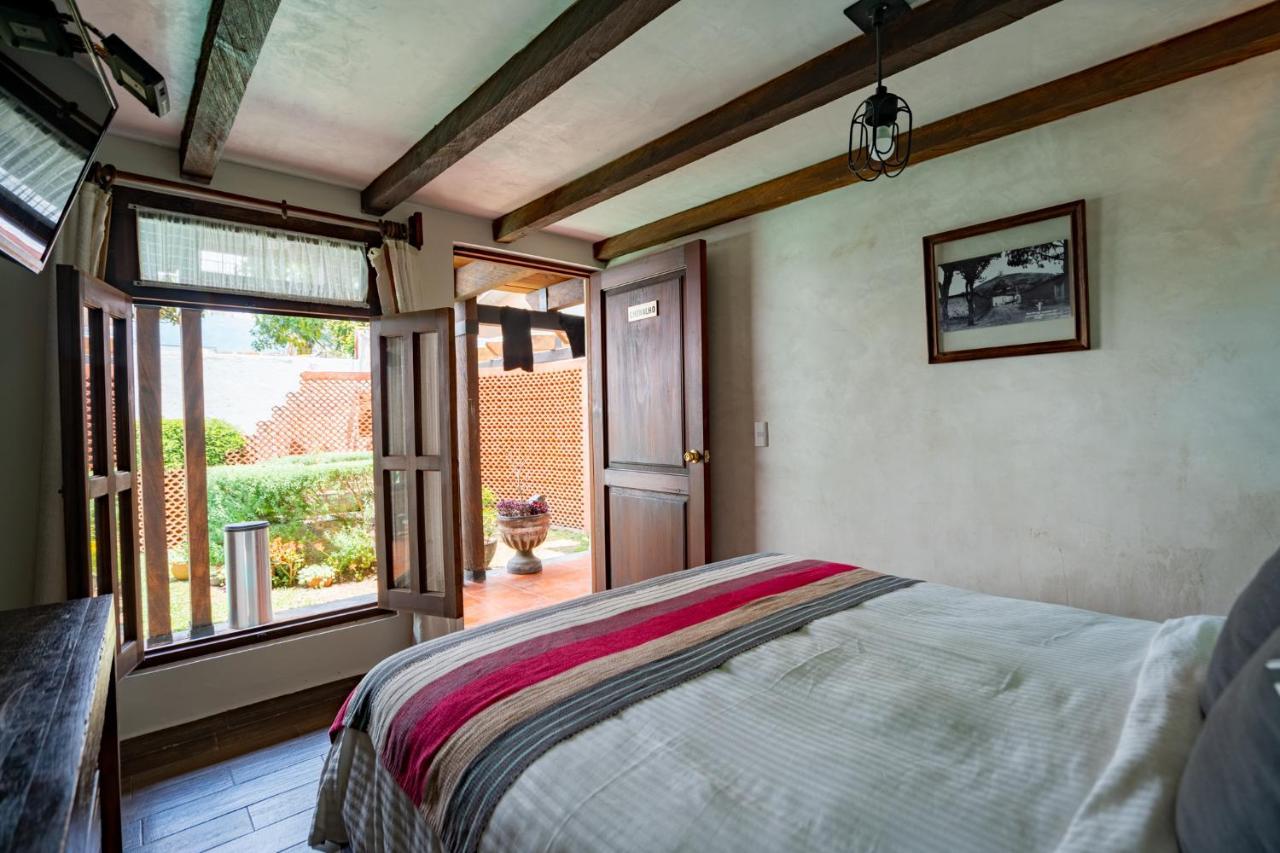 Yox Hotel Boutique San Cristóbal de Las Casas المظهر الخارجي الصورة A bedroom at the hotel